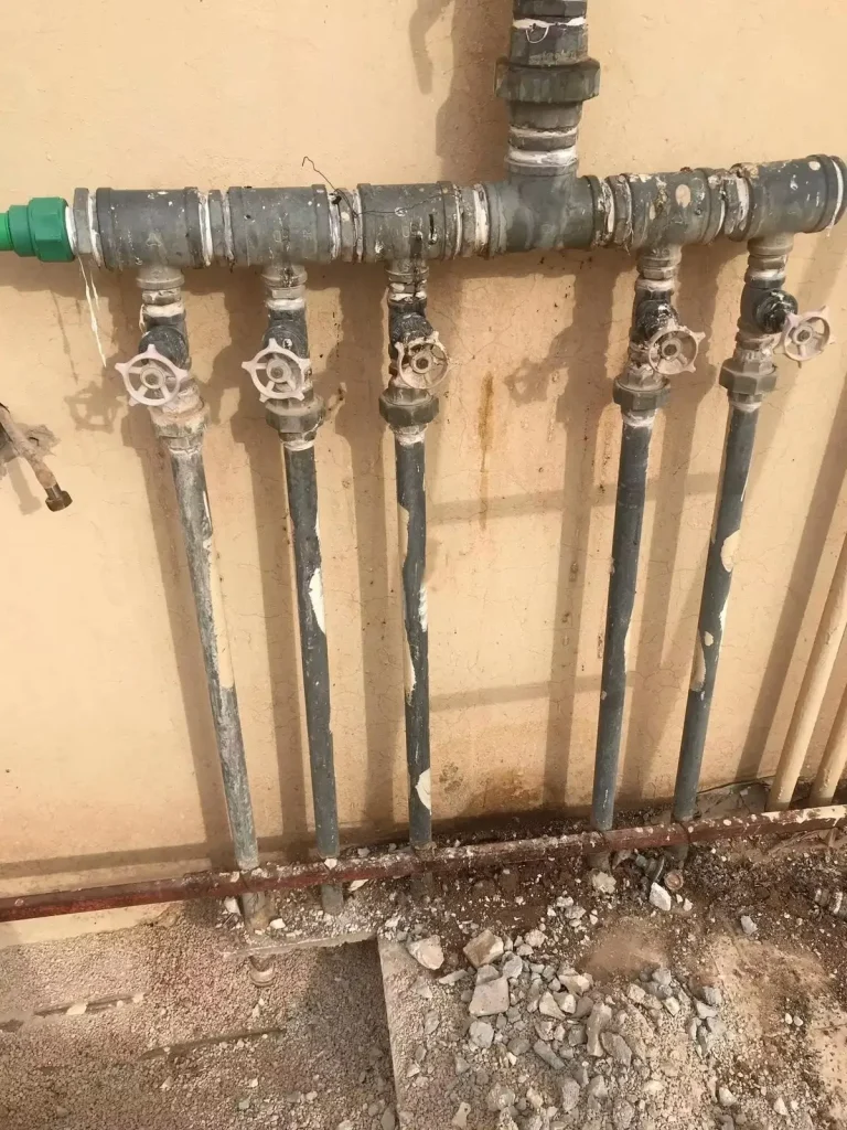 Green water pipes with valves installed.